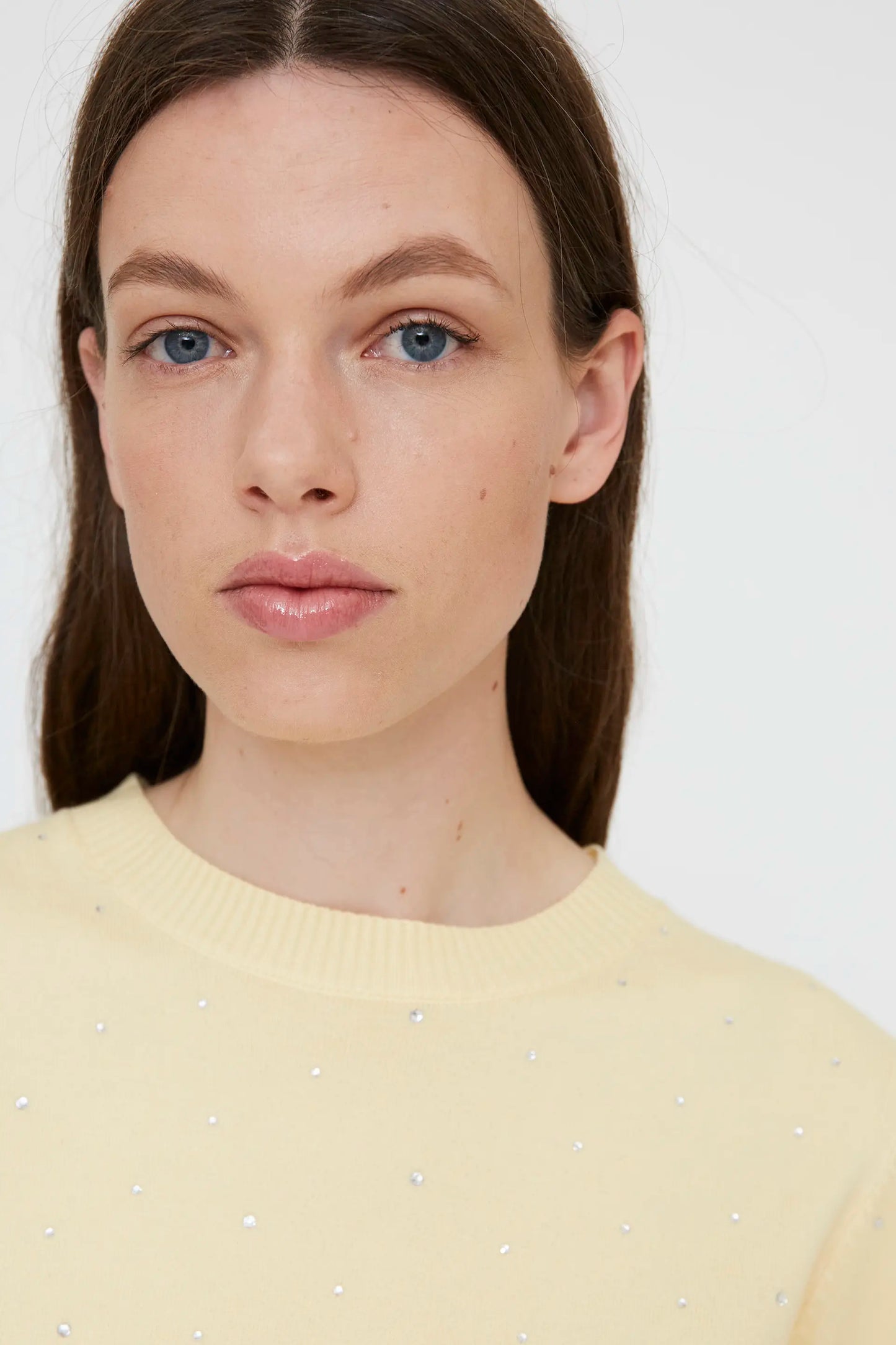 Yellow knit top with rhinestone detail