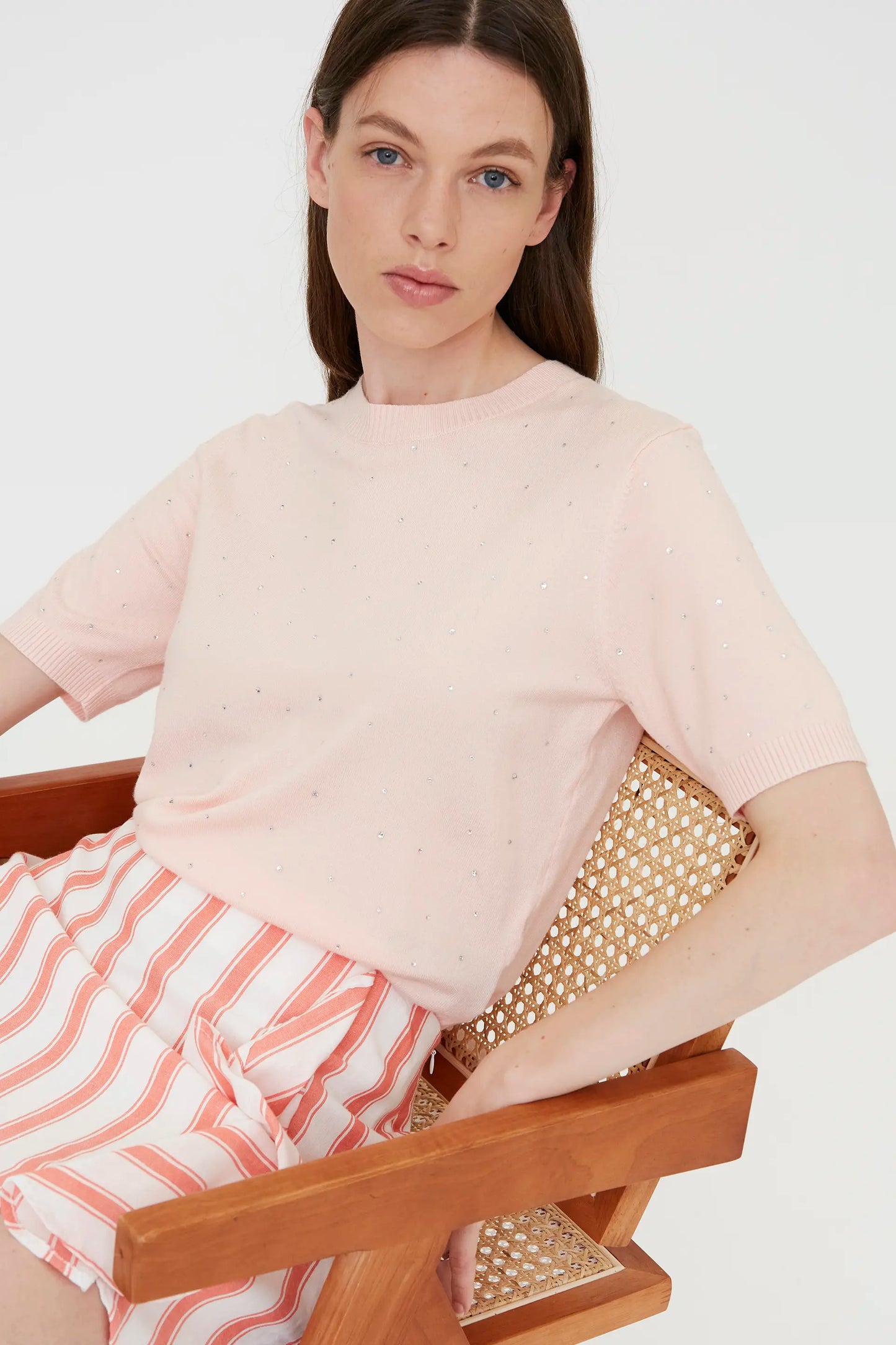 Pink knit top with rhinestone detail