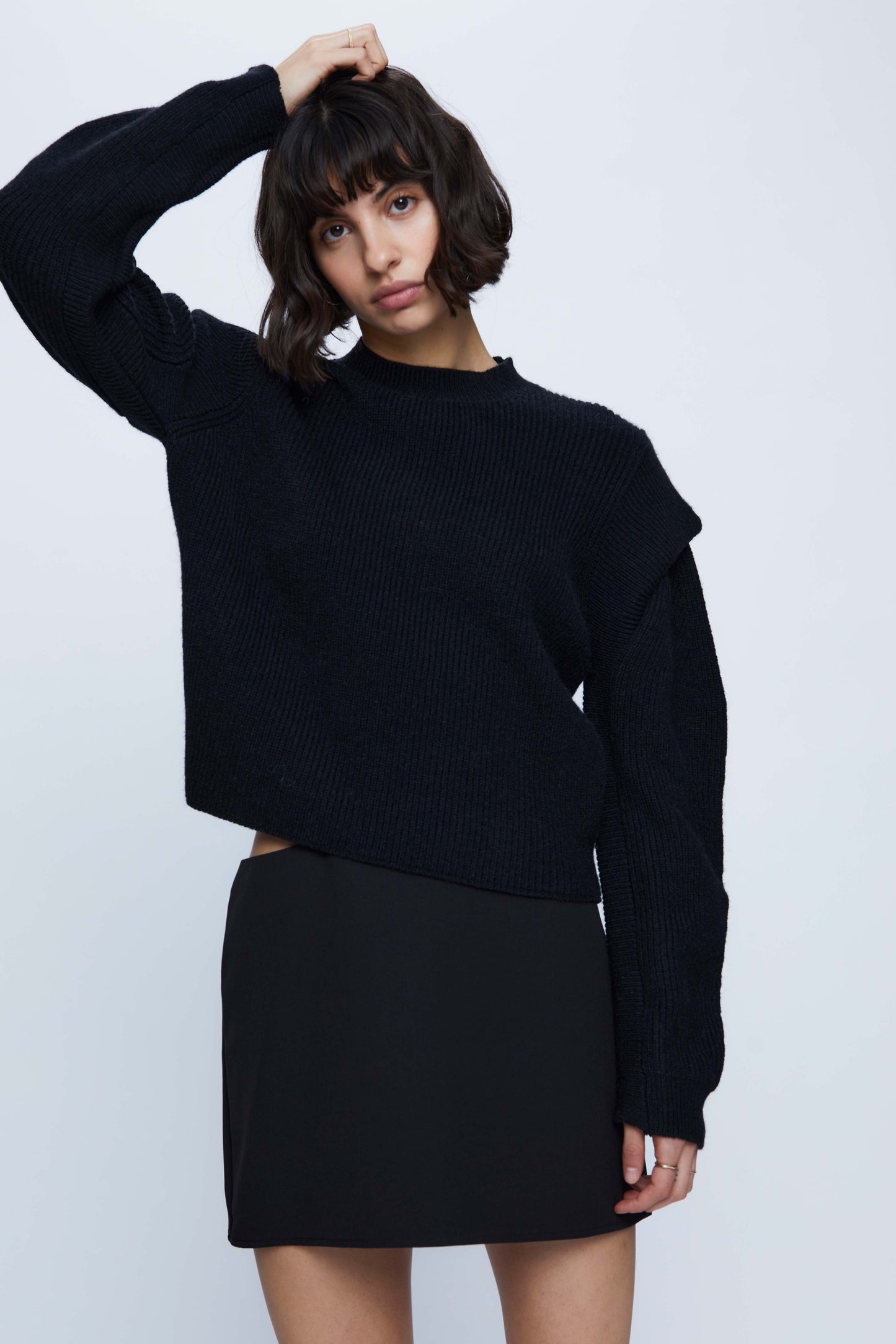 Black knitted sweater with shoulder detail