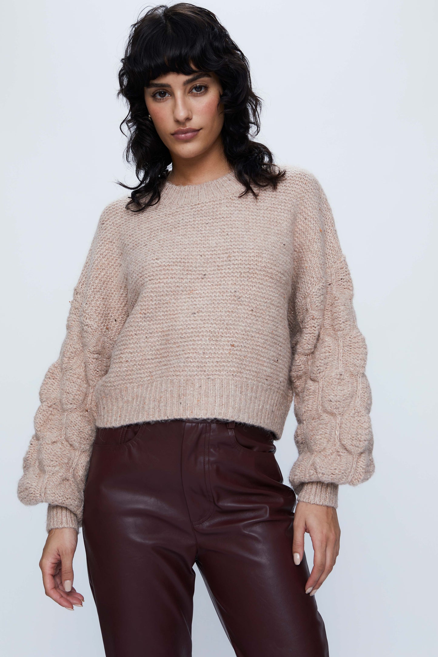 Knitted sweater with beige puff sleeves