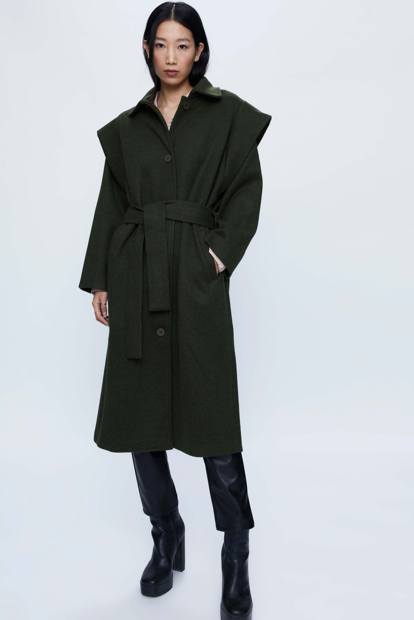 Long coat with green shoulder pads