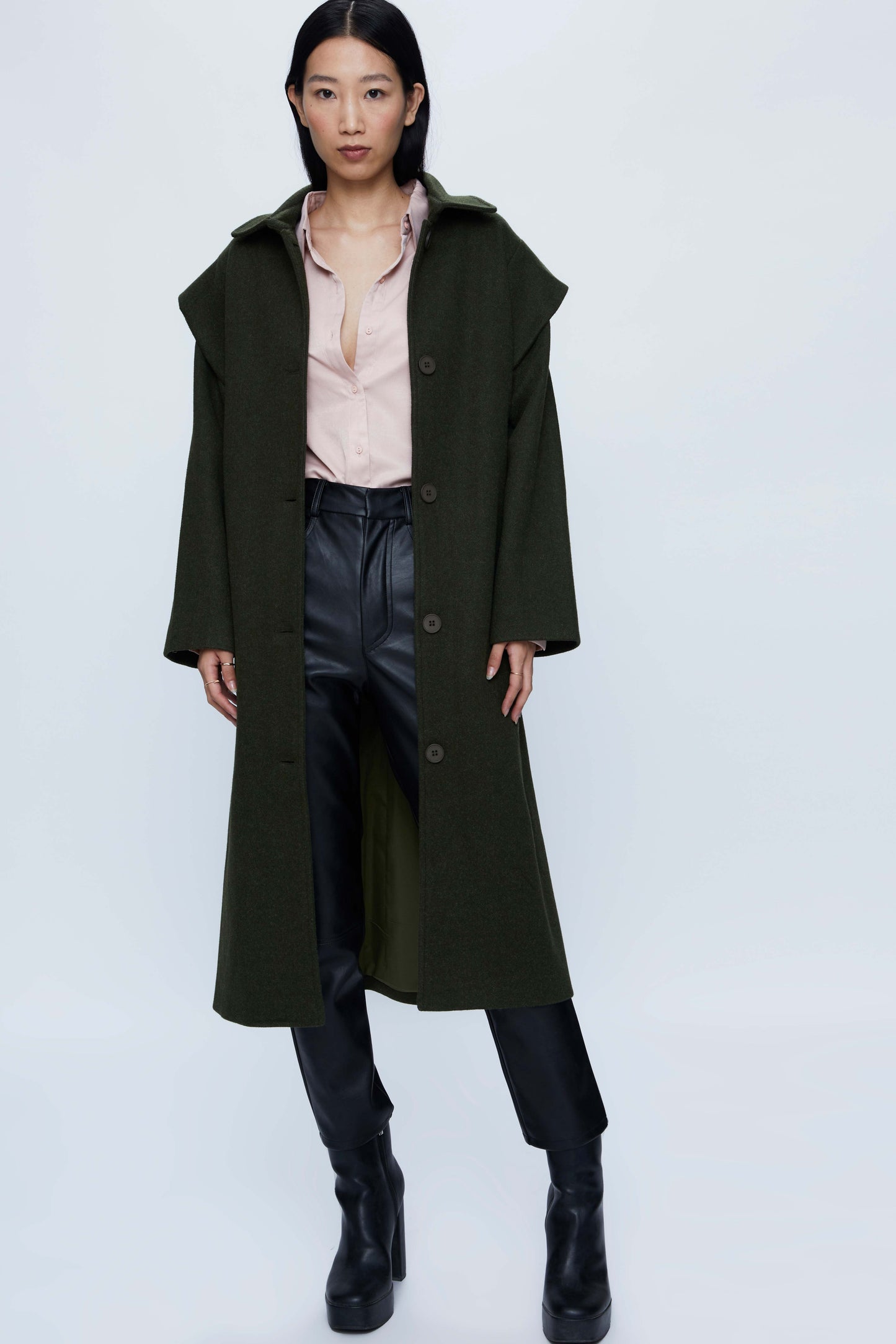 Long coat with green shoulder pads