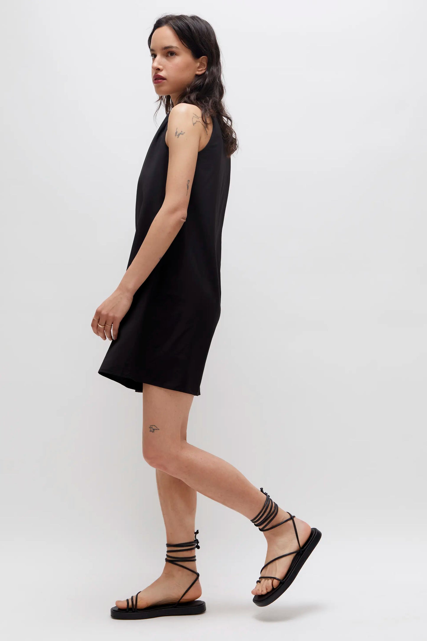 Short black satin dress with straps