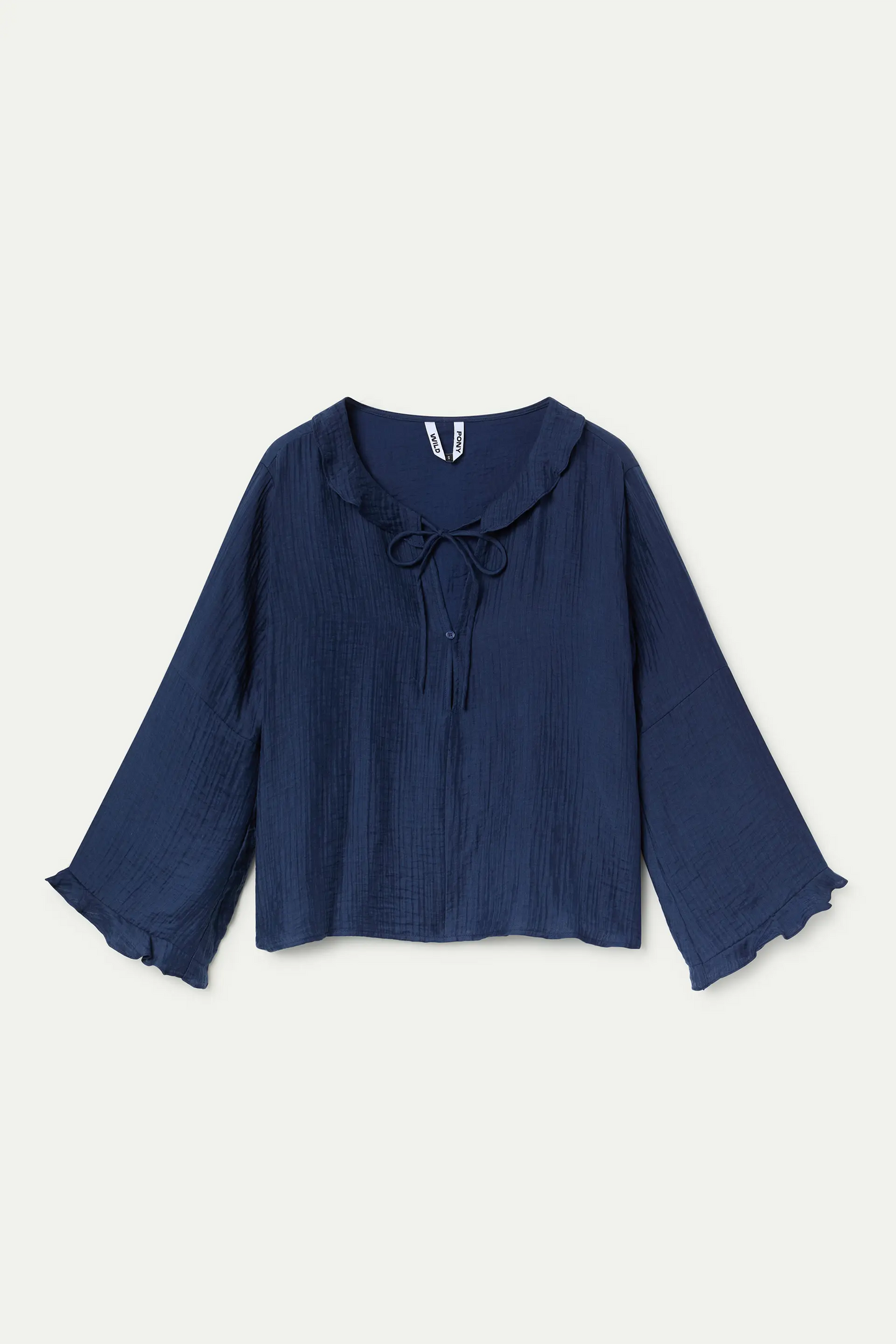 Top fluido con volantes azul