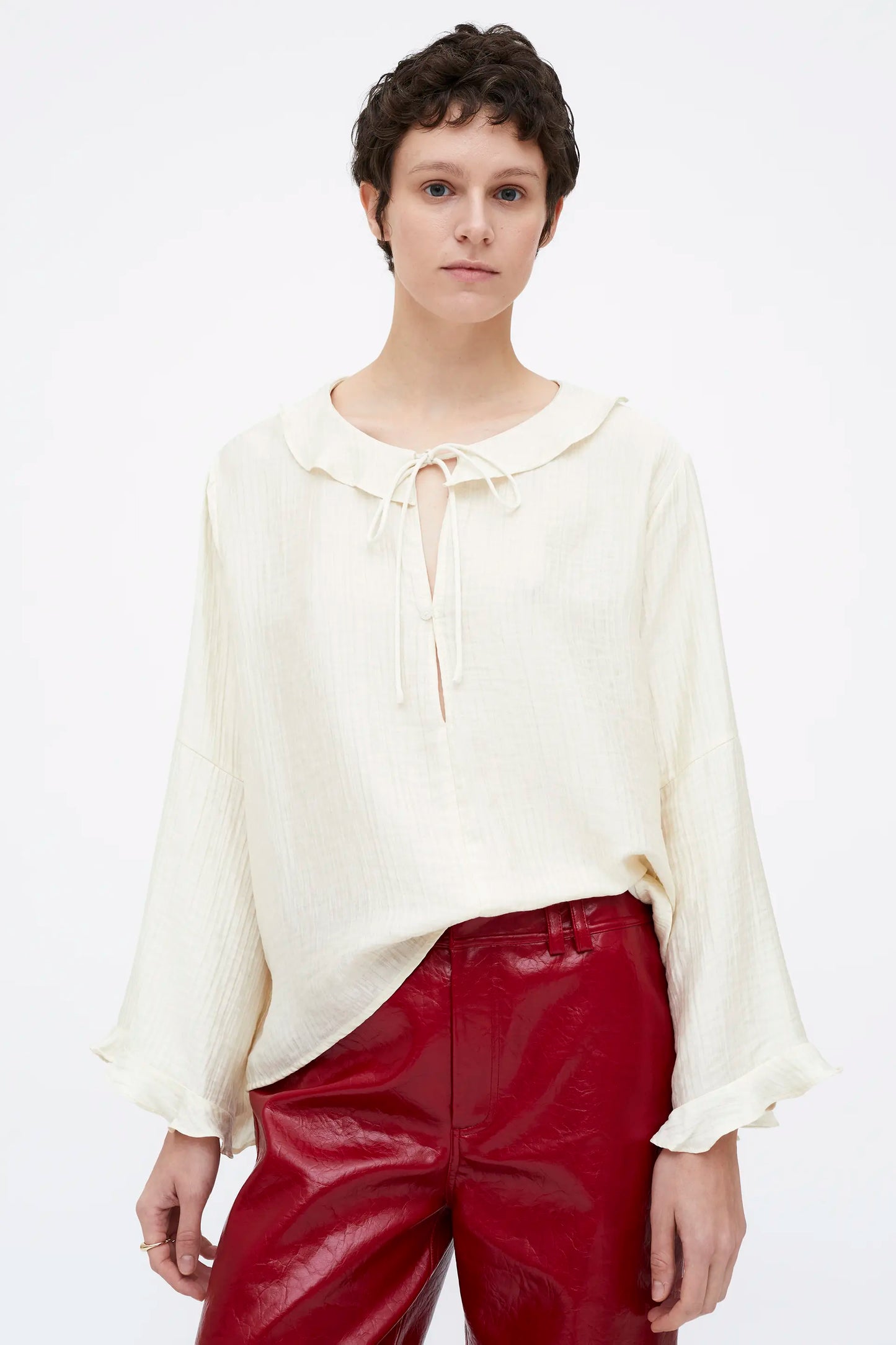 White flowing top with ruffles