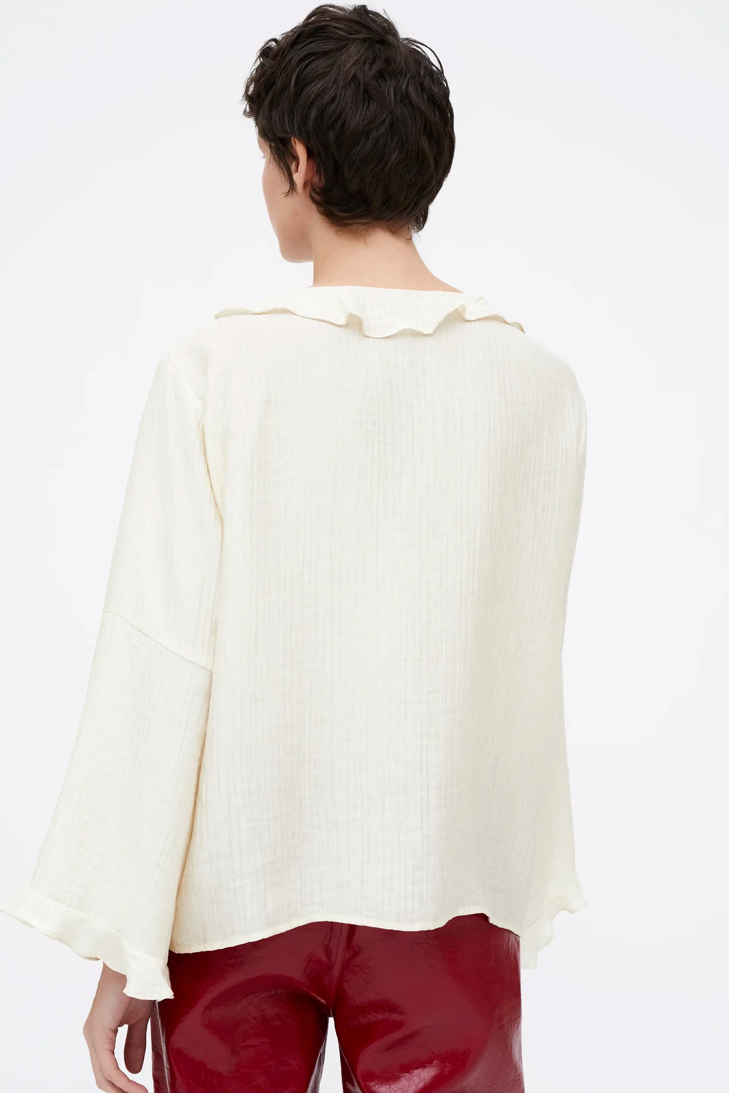 White flowing top with ruffles