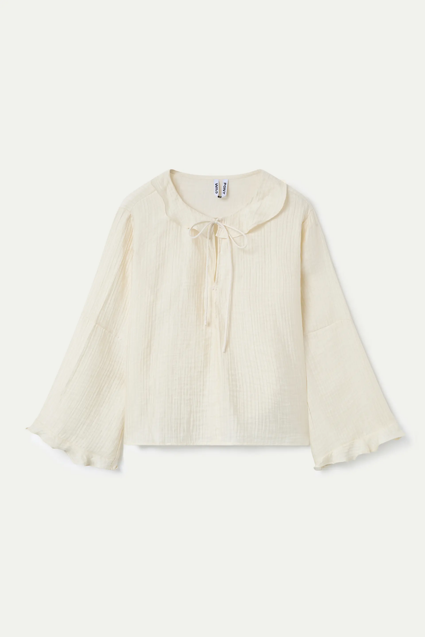 White flowing top with ruffles