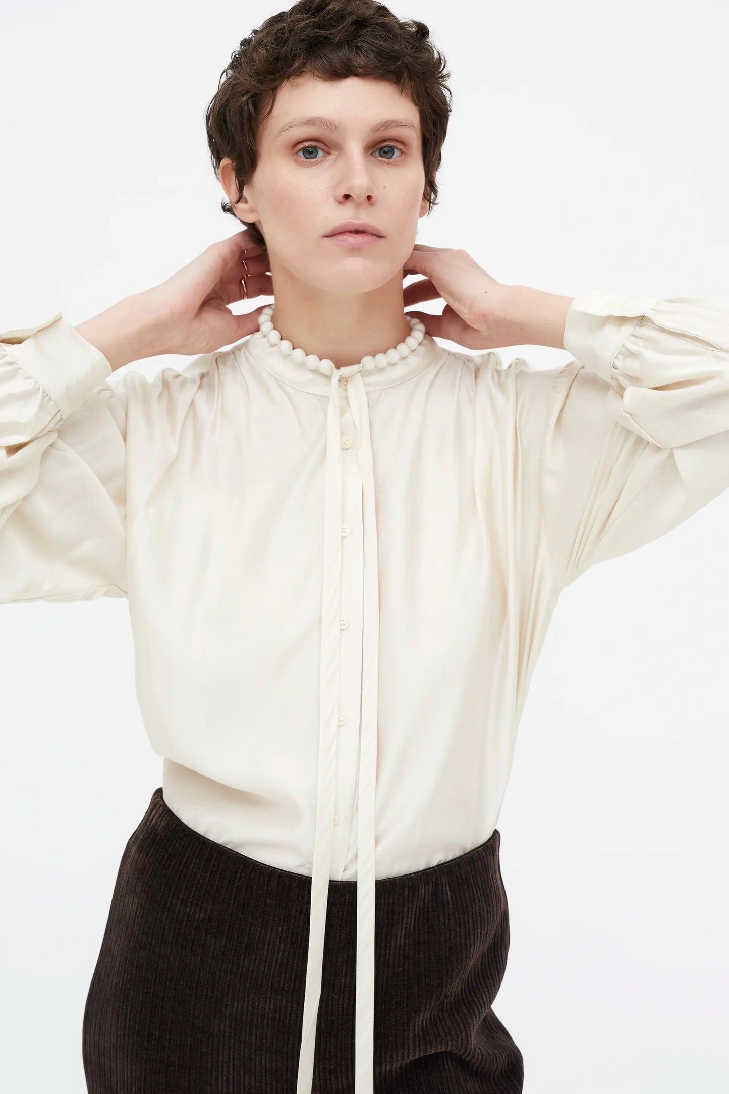 White flowing bow shirt