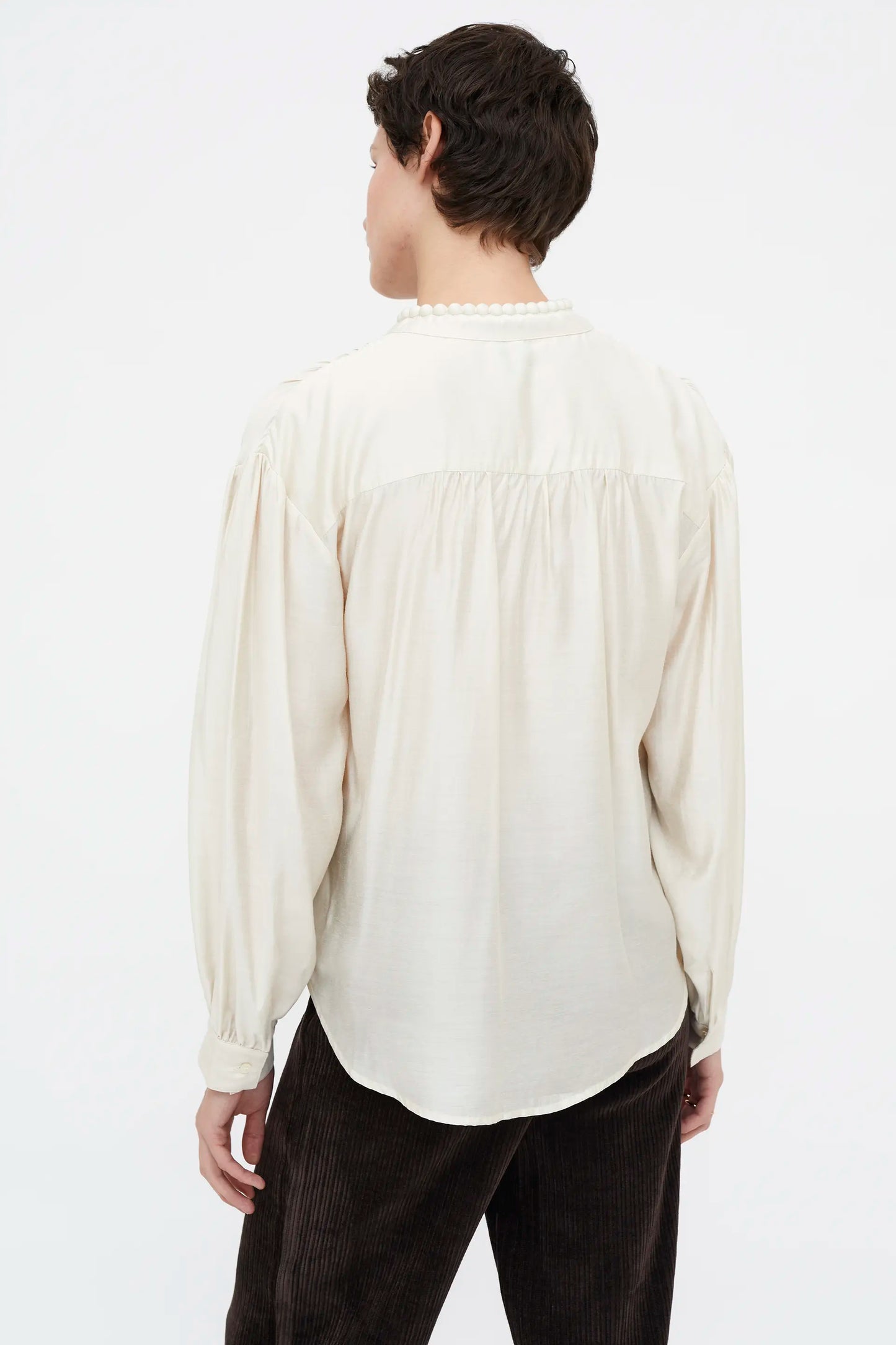 White flowing bow shirt