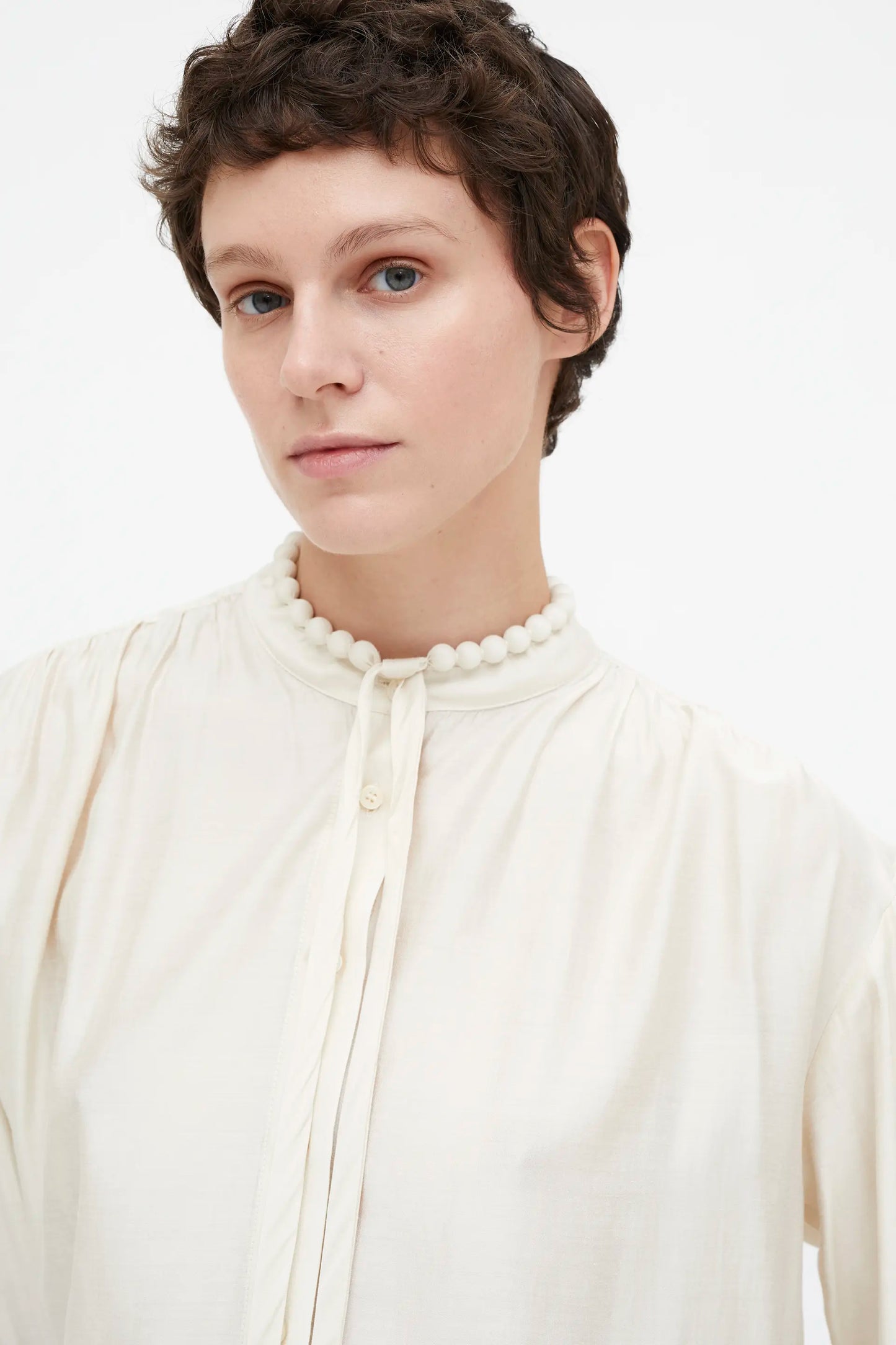 White flowing bow shirt