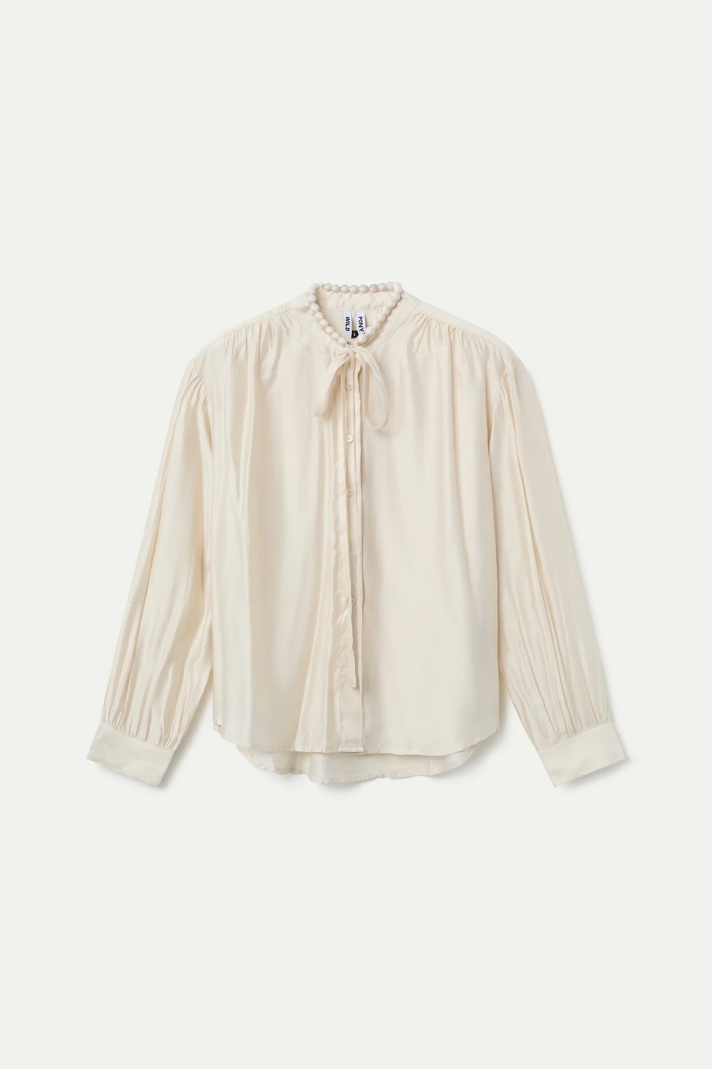 White flowing bow shirt