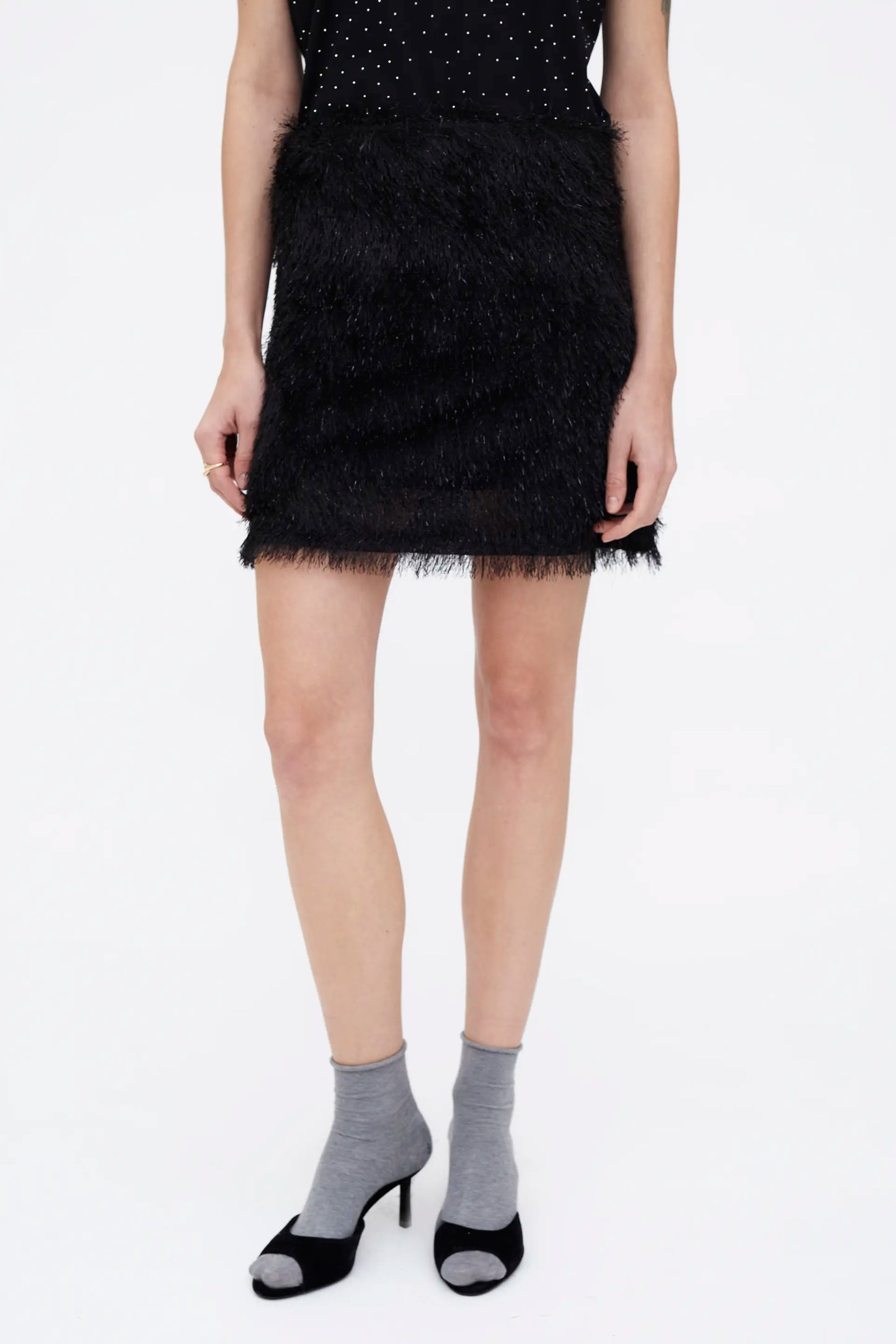 Falda corta negra con hilos Lurex