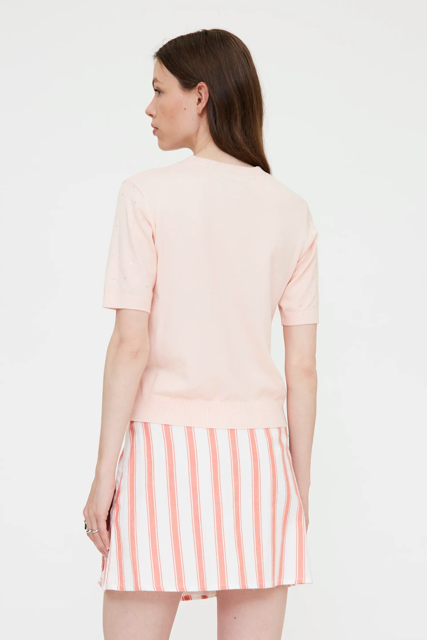 Pink knit top with rhinestone detail