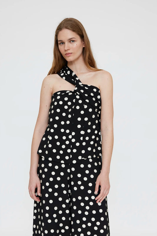 Asymmetrical top with black and white polka dot print