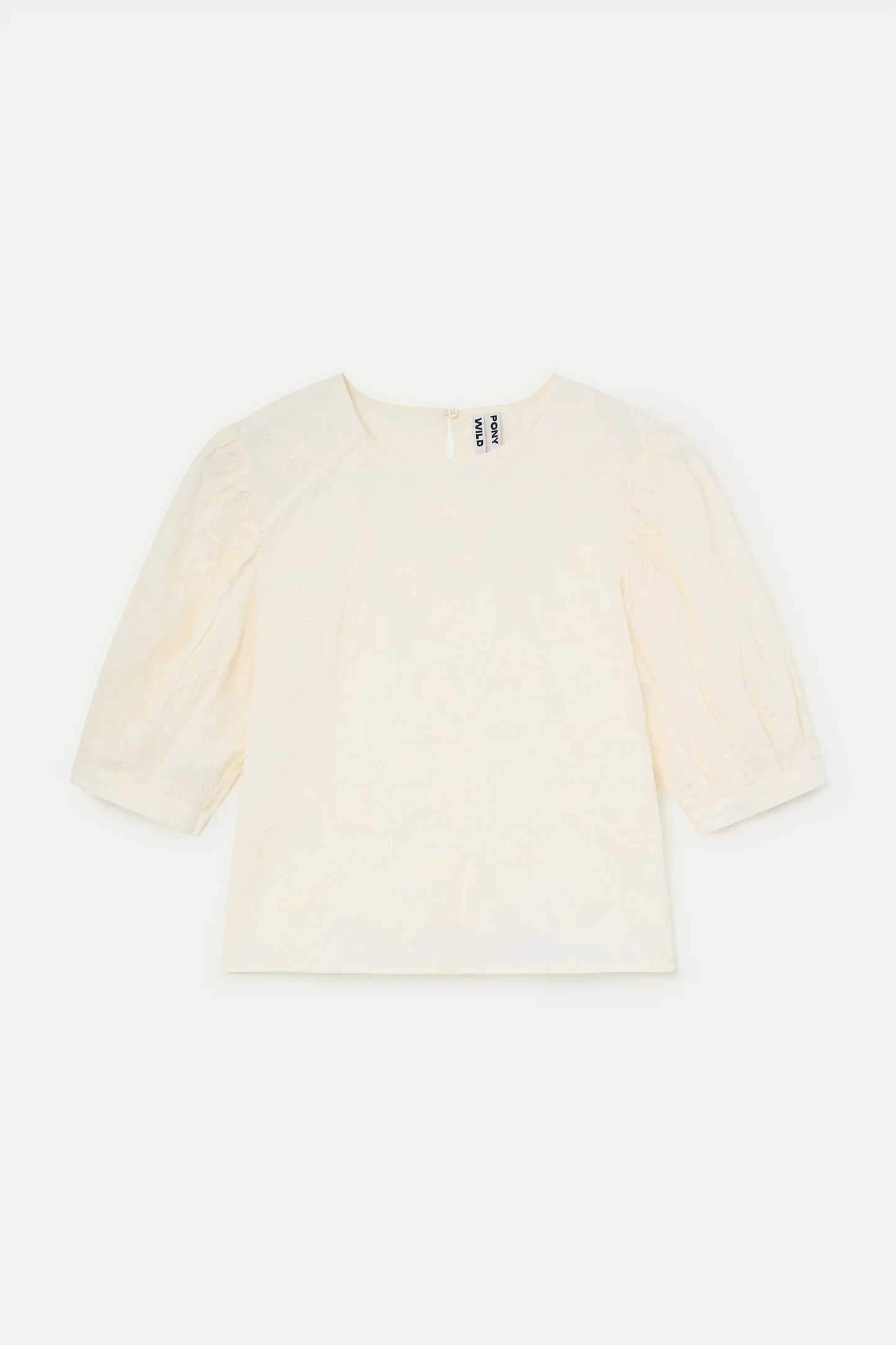 Top 100% algodón blanco roto con bordado floral