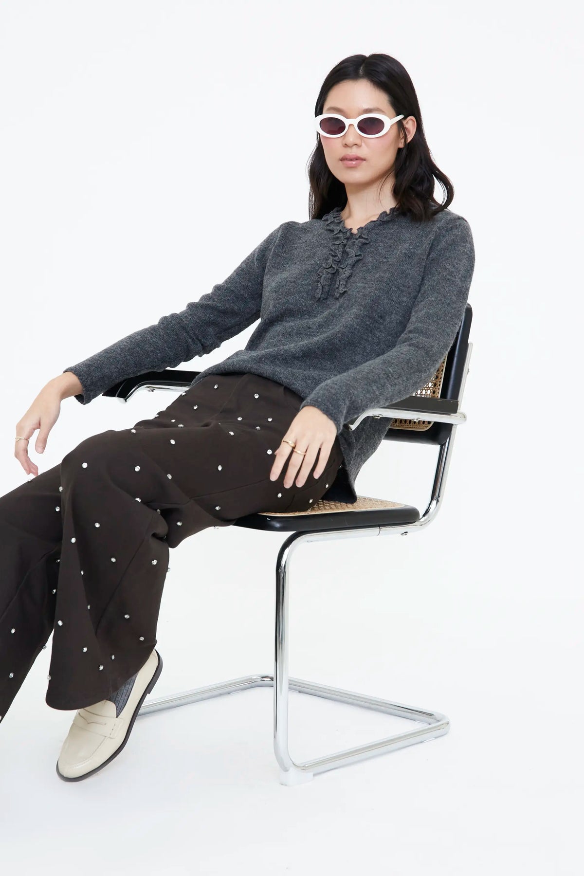 Grey knit sweater with mini ruffles
