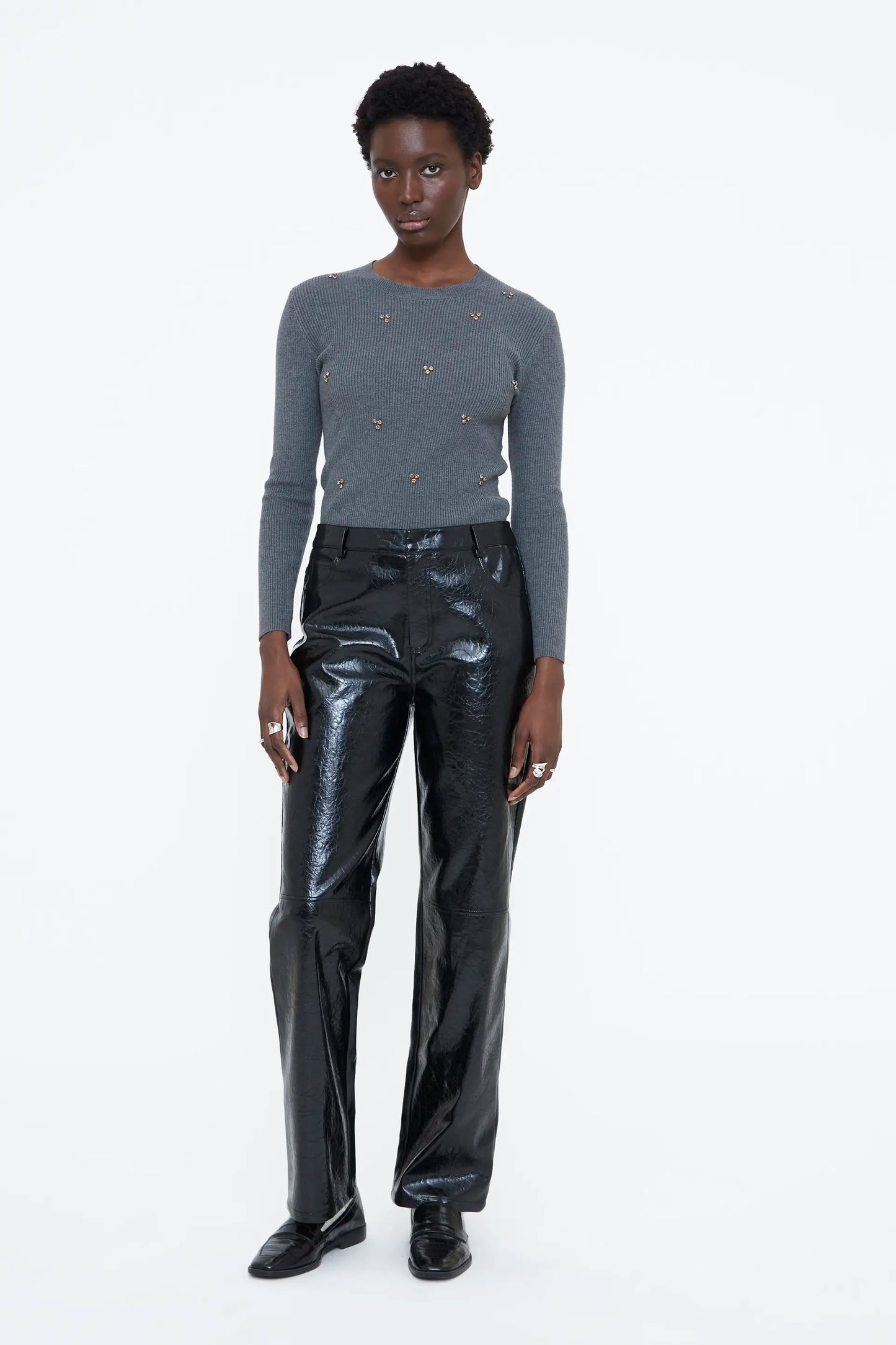 Gray sweater with multicolored appliques