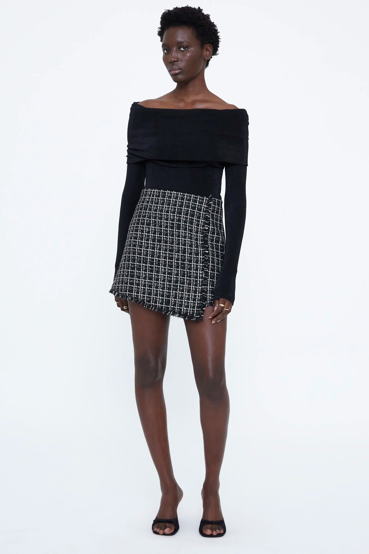 Falda corta tweed negra